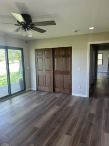 Residential room with a newly installed ceiling fan and recessed lights by Highmark Electric in Kearney, NE.
