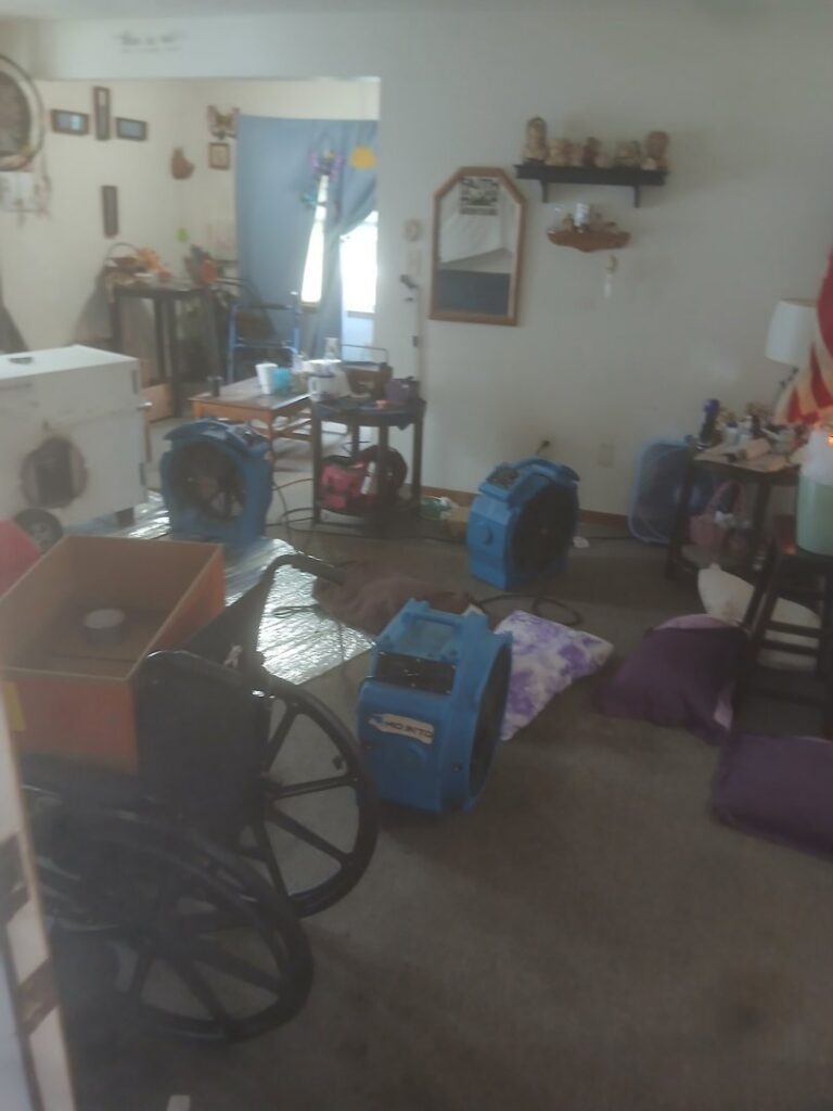 A room with multiple blue fans and heaters set up for pest control by All Seasons Pest Control LLC in Topeka, KS.