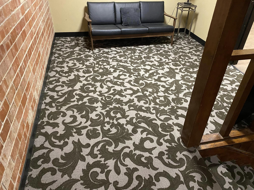A room featuring a newly installed patterned carpet by Top Quality Floors LLC in Oklahoma City, OK.