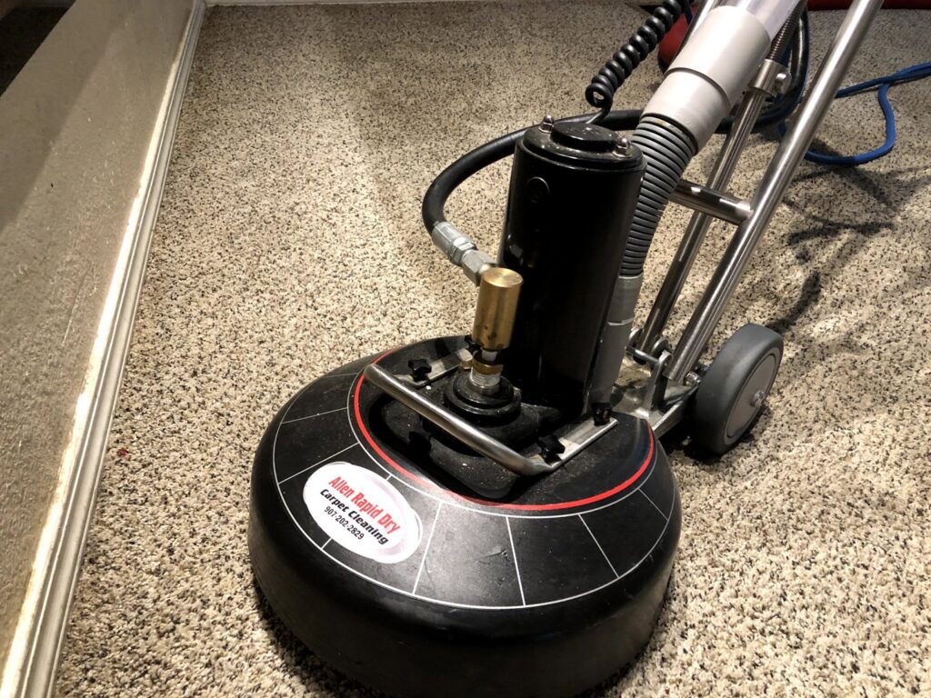 A rotary carpet cleaning machine in operation by Allen Rapid Dry Carpet Cleaning in Anchorage, AK.