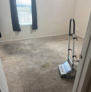 A rotary carpet cleaning machine on a dirty carpet by Arise Carpet Cleaning in Kailua, HI.