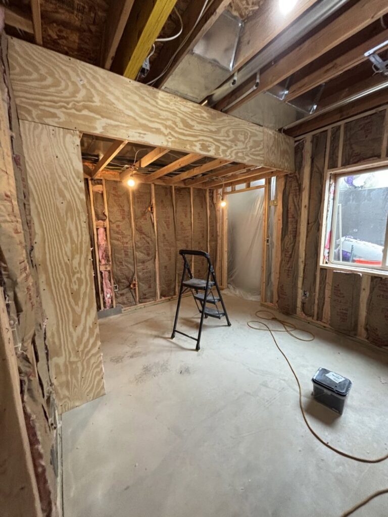 Exposed electrical wiring and temporary lighting during rough-in construction by Amped Electric in Virginia Beach, VA.