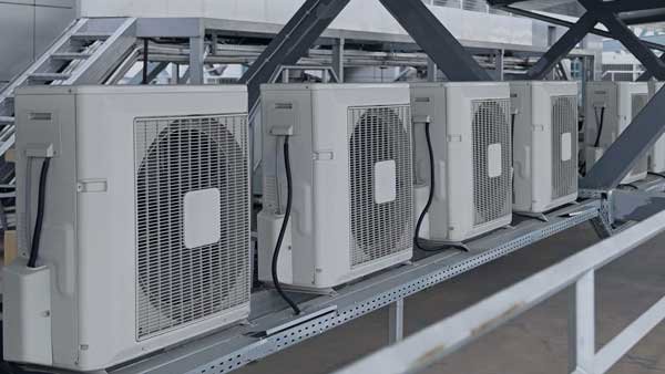 A row of commercial outdoor AC units installed by Glendale HVAC in Glendale, AZ