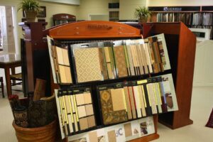 Royal Dutch and various carpet samples displayed on racks at Jimmie Lyles Flooring Gallery in Flowood, MS