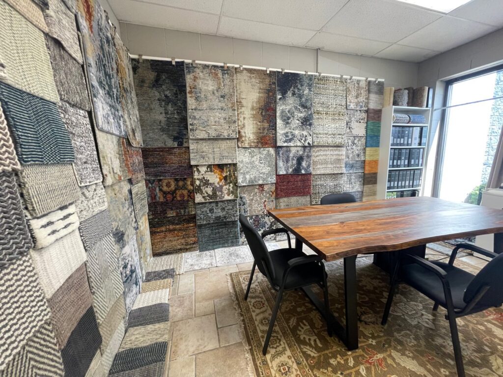 Interior view of the rug and carpet showroom display at Rugs By Design in Castleton, IN
