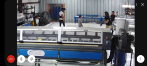 An industrial rug cleaning facility with large machinery at Advanced Cleaning Systems in Atlanta, GA.