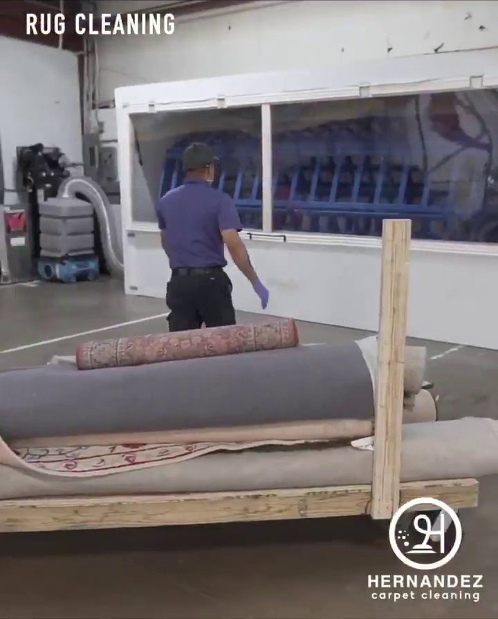 A technician operating a large rug cleaning machine for Winston Salem Carpet Cleaning by Hernandez in Greensboro, NC.