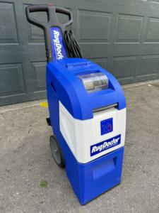 A blue and white Rug Doctor carpet cleaning machine used by Sissons Steadfast Cleaning LLC in Wasilla, AK.