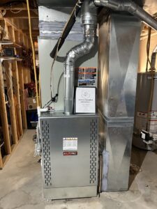 A RunTru indoor furnace and air handler unit with ductwork installed by Sandys Heating & Air in Papillion, NE.