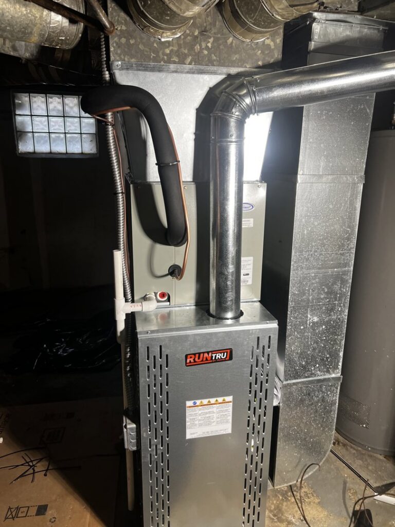 A new RunTru furnace and associated ductwork installed by All Around Heating & Cooling, an HVAC contractor in Akron, OH.