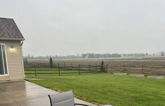 A rural property featuring a wooden split-rail fence installed by Premier Fence LLC in Canton, MA.