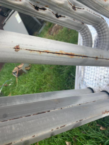 Significant rust and damage on an HVAC heat exchanger, showing a common issue repaired by Ammons Mechanical LLC in Durham, NC.