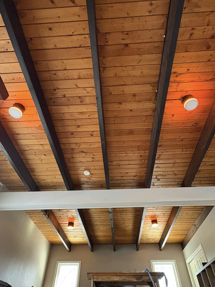 Stylish ceiling lights professionally installed on a rustic wooden ceiling by East West Electric LLC in Chester, NH.