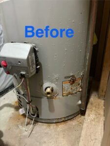 A rusty and leaking water heater before service by American Air LLC in Moncks Corner, SC