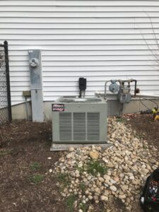 A Ruud outdoor AC unit installed by Wight's Heating & Air Conditioning in Rockford, IL