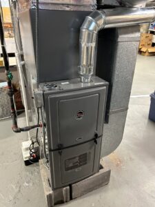 A Ruud furnace and ductwork installation in a basement by Climate Diagnostics in Buffalo, NY.