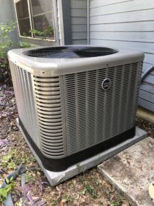 A newly installed Ruud outdoor AC unit by Eagle Heating & A/C for a residential property in San Antonio, TX.