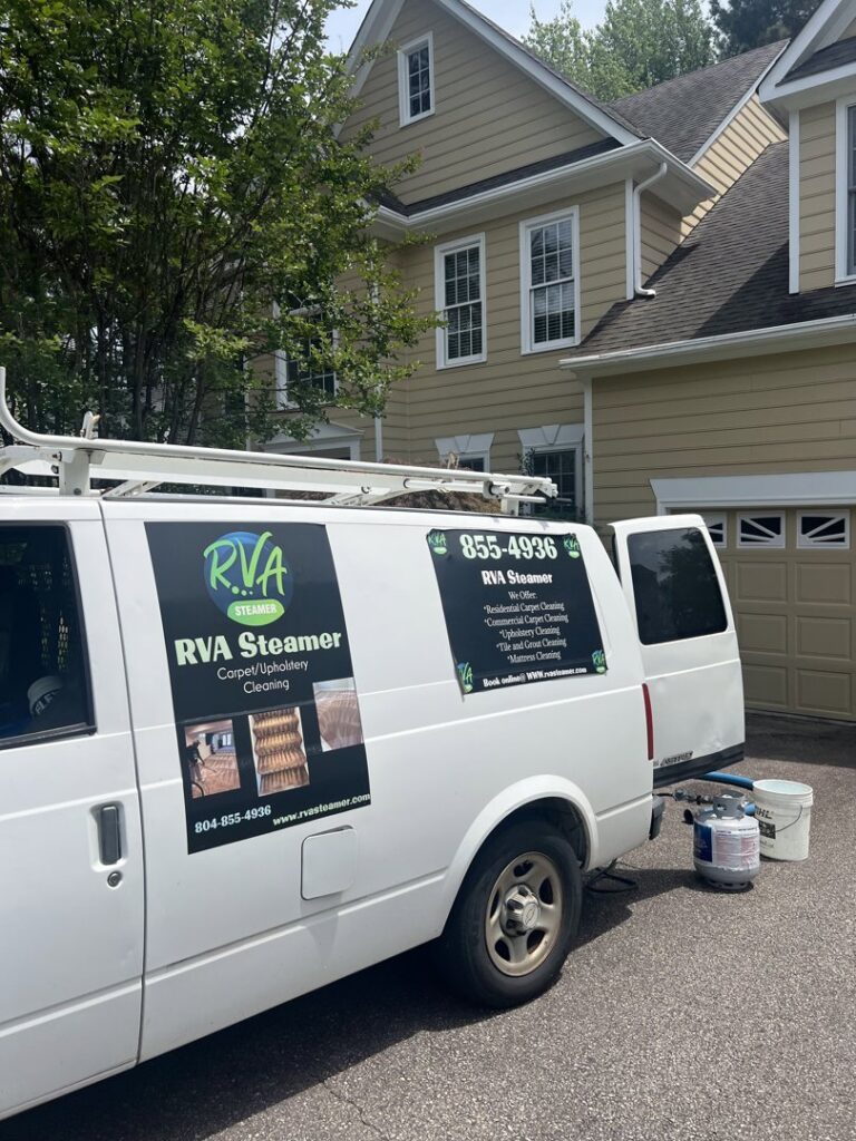 RVA Steamer service van with carpet cleaning equipment parked outside a residential home in Richmond, VA