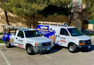 Two RW Mechanical Inc. HVAC service vehicles, a pickup truck and a van, parked in Las Vegas, NV.