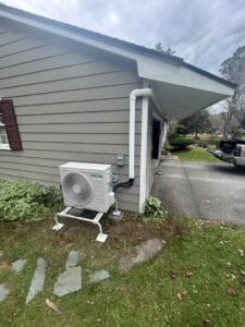 An outdoor Samsung heat pump unit installed on the side of a residential building by Rockys electric in La Junta, CO.