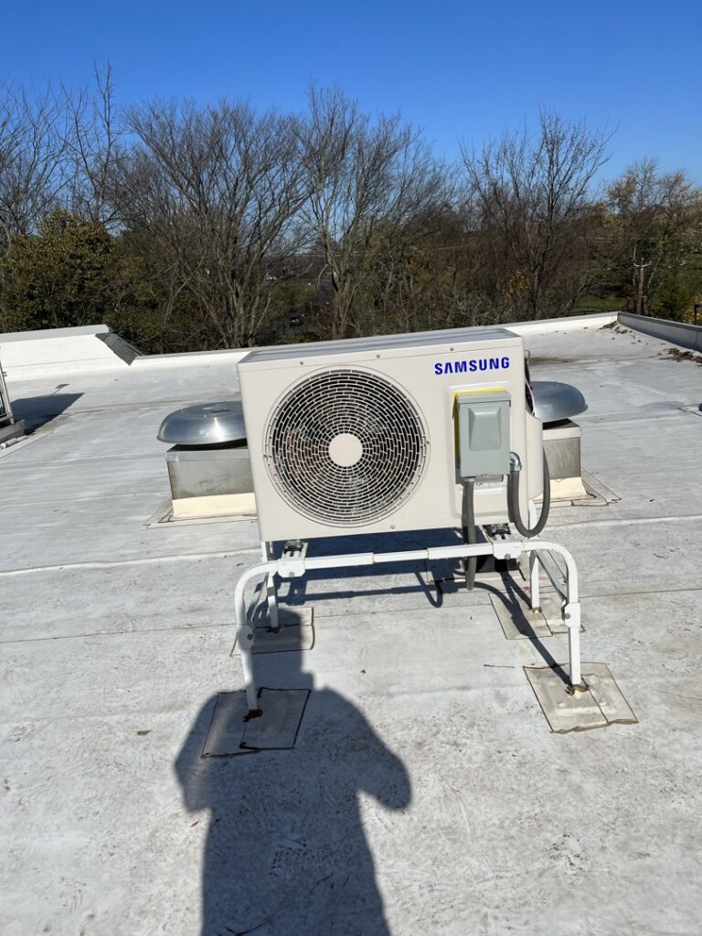 A Samsung outdoor mini-split condenser unit installed on a rooftop by Green Mechanical LLC in Philadelphia, PA.
