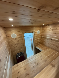 Sauna interior with recessed lighting and speakers installed by Black Electric & Sound in Minot, ND.
