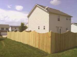 A newly installed scalloped wooden privacy fence around a residential backyard by A Freedom Fence in Martinsburg, WV.