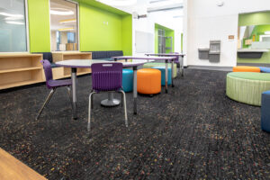 A vibrant school classroom or learning space with durable speckled carpet installed by The Carpet Shoppe in Springfield, MO.