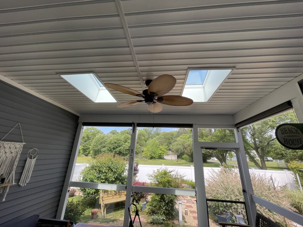 A newly installed ceiling fan in a screened porch, providing ventilation services by L & R Electrical and HVAC Services in San Marcos, CA.