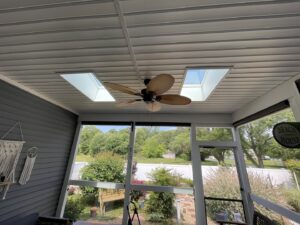 A newly installed ceiling fan in a screened porch, providing ventilation services by L & R Electrical and HVAC Services in San Marcos, CA.