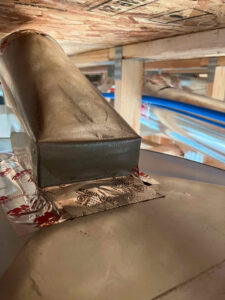 A close-up of a sealed duct connection with foil tape by Green Seal Energy in Overland Park, KS.