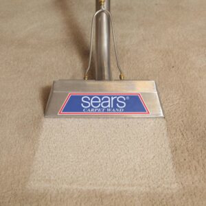 A close-up of a Sears carpet wand cleaning a carpet, revealing a clean strip at Sears Carpet Cleaning in Cleveland, OH.