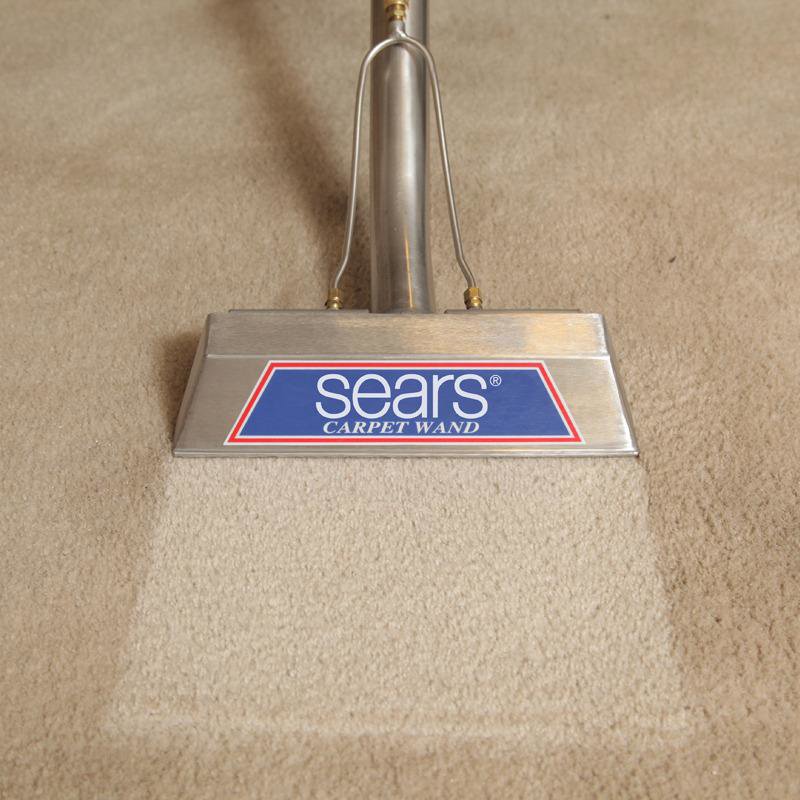 A close-up of a Sears carpet wand cleaning a carpet, revealing a clean strip at Sears Carpet Cleaning in Cleveland, OH.