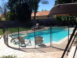 A secure pool area featuring a removable mesh fence installation by Baby Guard Pool Fence Los Angeles, CA
