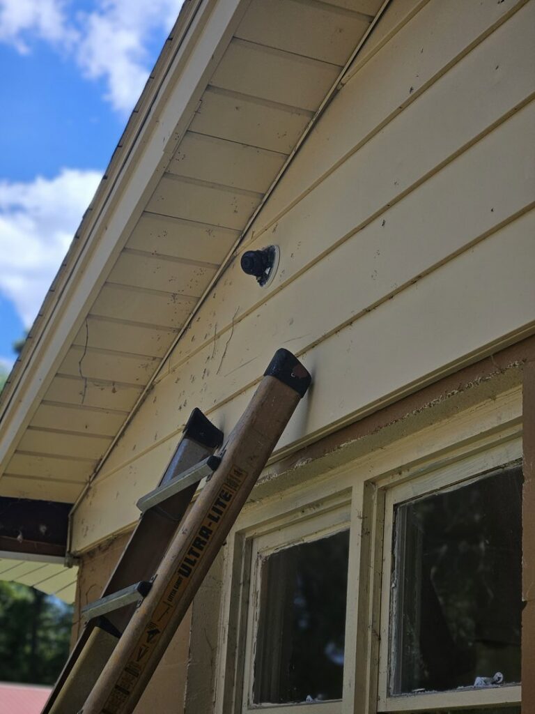 Installation of an outdoor security camera on a house by JAL Electrical Construction in Hammond, IN.