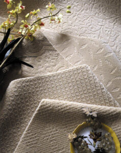 A selection of carpet swatches in neutral tones and patterns available at Georgia Floors Direct in Tallahassee, FL