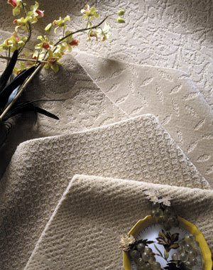 A selection of carpet swatches in neutral tones and patterns available at Georgia Floors Direct in Tallahassee, FL