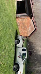 Best Termite & Pest Control, Inc. service truck parked at a job site in Manchester, KY.