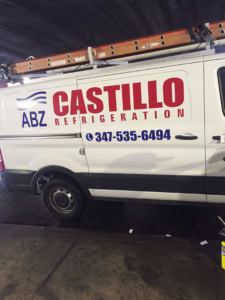 A white service van with ABZ Castillo Refrigeration branding and a ladder on the roof rack in Yonkers, NY