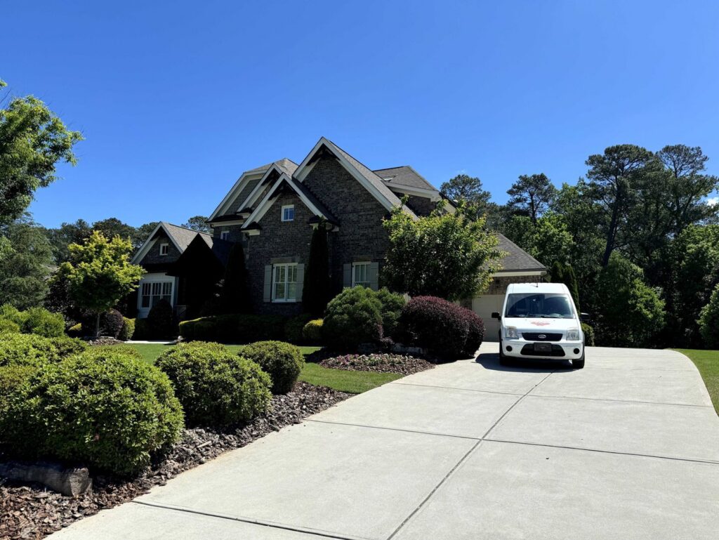 A Johns Creek Carpet Cleaner service van parked outside a house for a carpet cleaning job in Johns Creek, GA.