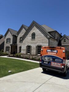 An Advanced Cleaning Systems service van parked outside a residential home in Atlanta, GA, ready for a job.