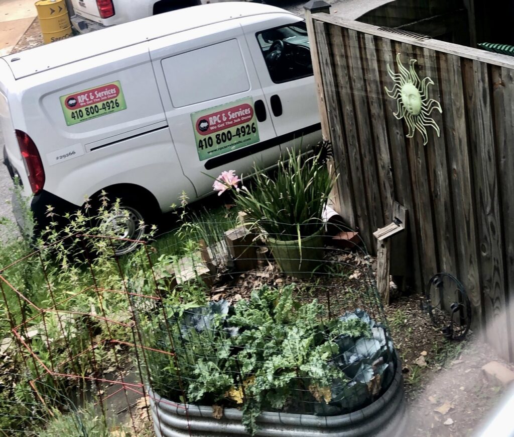 A service van for RPC & Services LLC parked at a client's property for wildlife and pest control services in Baltimore, MD.