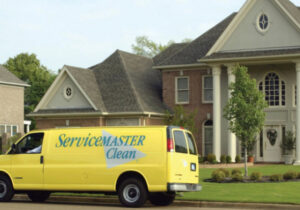 A ServiceMaster Clean van parked outside a residential home for a carpet cleaning job by ServiceMaster Albino in Waterbury, CT.