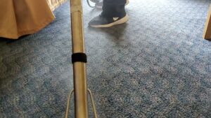 Severely damaged carpet with exposed subfloor, ready for repair by The Carpet Chemist in Louisville, KY.