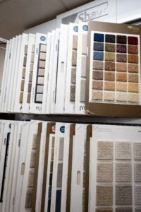 A showroom display featuring a wide variety of Shaw carpet samples at Mill Sales Co. in Los Angeles, CA