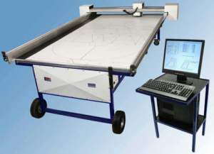 A sheet metal cutting machine fabricating custom ductwork patterns for NiTec Inc, an HVAC contractor in Hagerstown, MD.