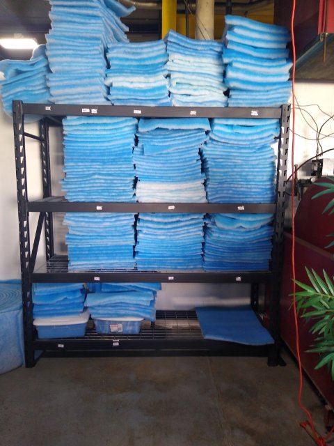 Shelves stacked with blue HVAC filter media at Murray Filter Sales and Service, Inc. in Nashville, TN