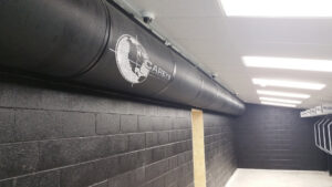 A long black ventilation duct system installed in a shooting range by Carey's Small Arms Range Ventilation in Tinley Park, IL.