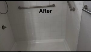 An "After" view of a newly tiled shower installation completed by Carpet Planet LLC in Colorado Springs, CO.