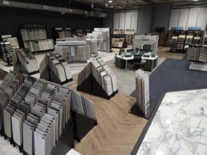 A wide view of the showroom displaying various carpet samples at Flooring NuVo in Gretna, NE.